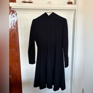 The perfect little black dress. Fitted waist, lined with full skirt. Like new.